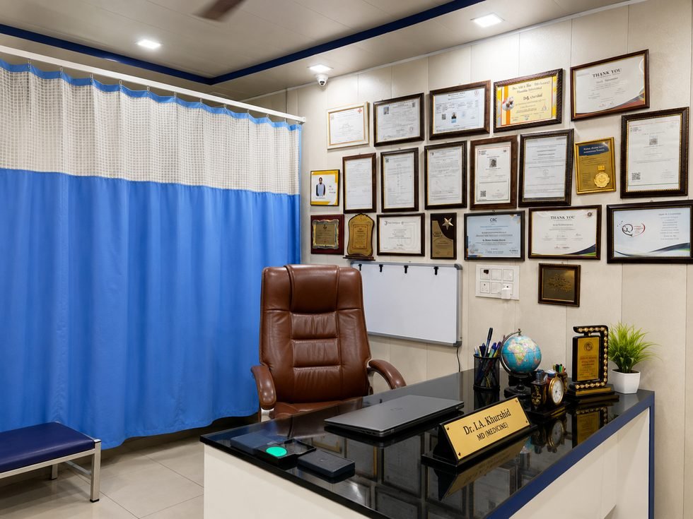 Consultation room at Medihealth Nursing Home with certificates displayed